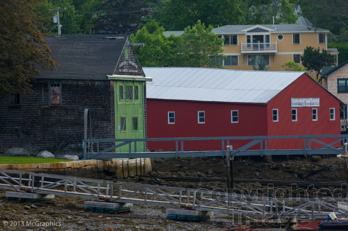 Boat repair buildings on the shore at Camden, Maine.