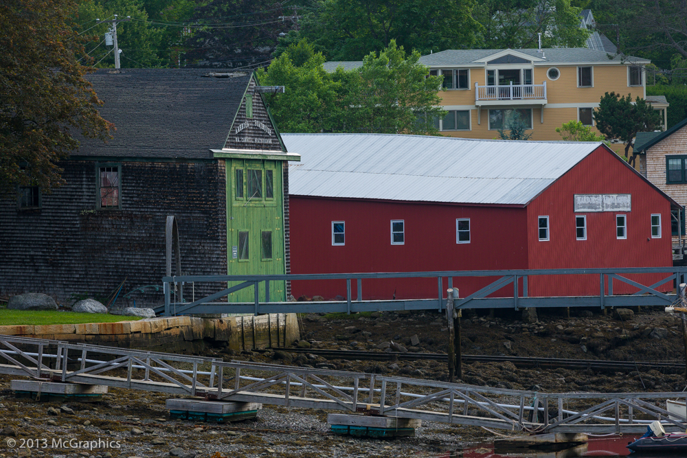 Boat repair buildings on the shore at Camden, Maine.